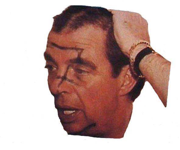 Morton Downey, Jr., with his backward swastika